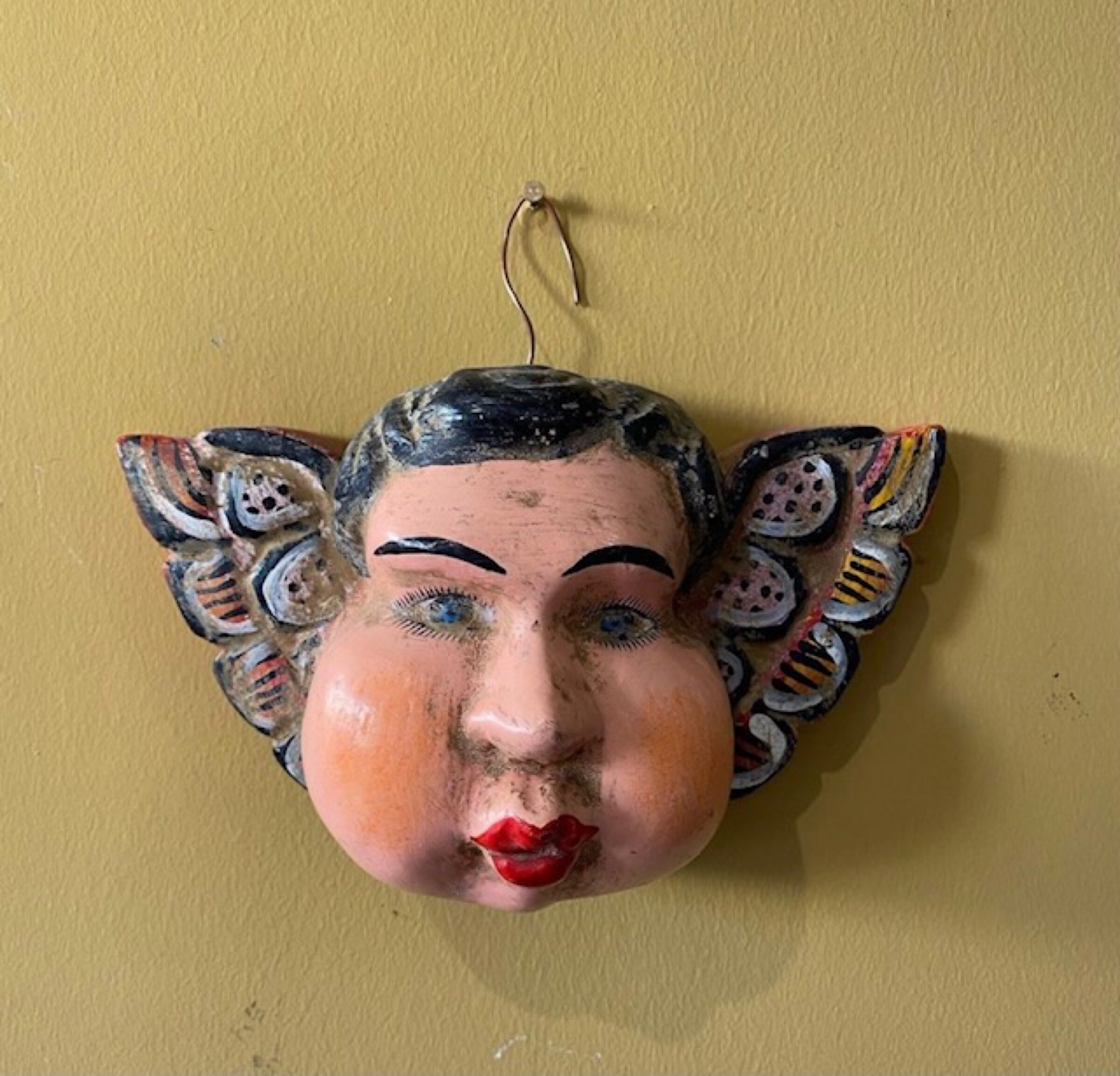 Ceramic head on wall