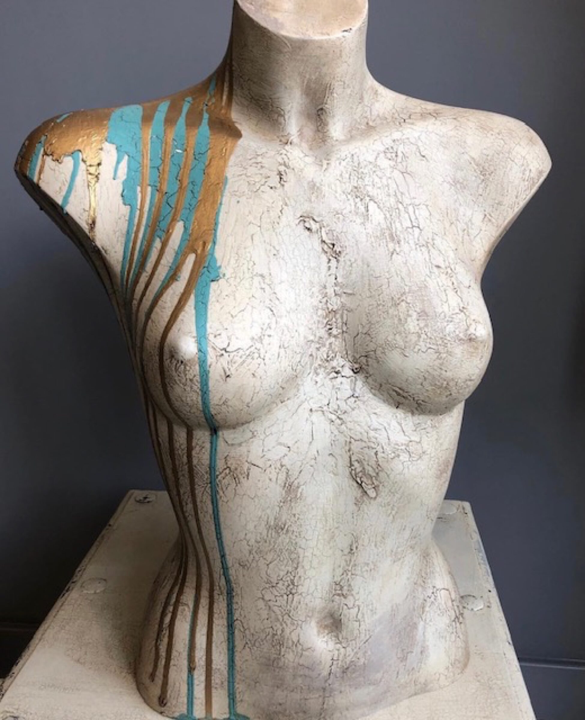 Stone female bust with paint splashes