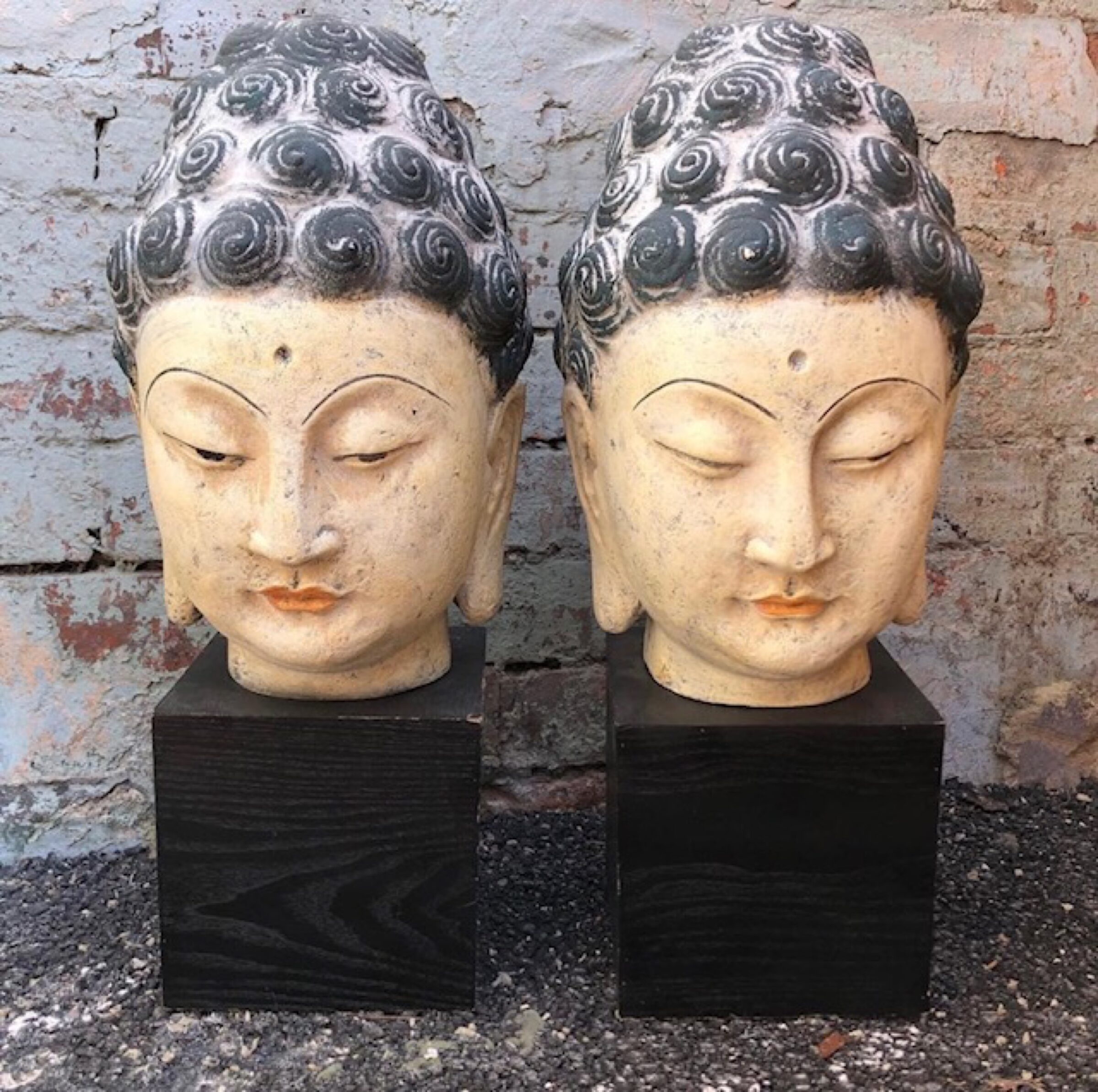 Two female stone heads